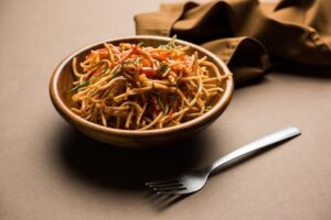 chinese-bhel-is-spicy-indo-chinese-recipe-served-bowl-selective-focus_466689-52131