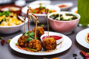 side-view-chicken-meatballs-with-greens-ketchup-plate_141793-4839